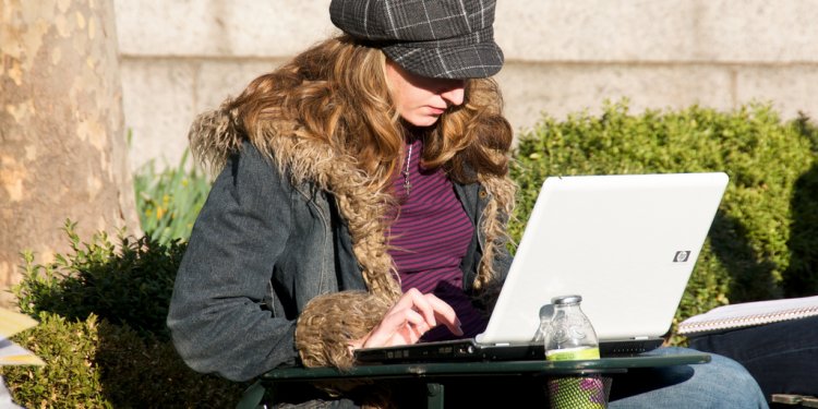 One of the rare non-Apple laptops seen in an otherwise cool park full of cool people